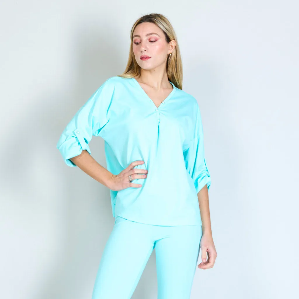 Blouse with buttoned pearls wholesale