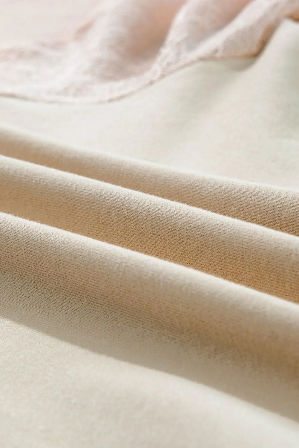 Chic knit patchwork pullover in parchment